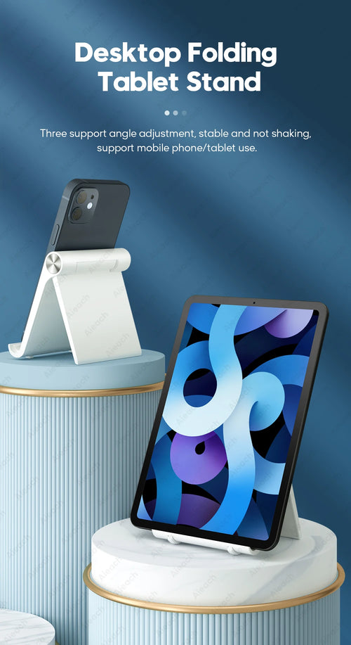 Voltic Desktop folding tablet stand with a tablet and smartphone on it against a blue background